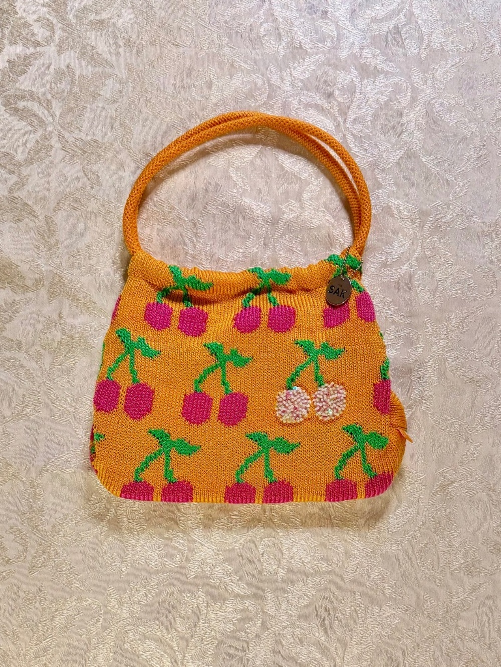 The Sak - Cherry Print Mini Handbag - Crochet Knit Beaded Sequin Orange Pink